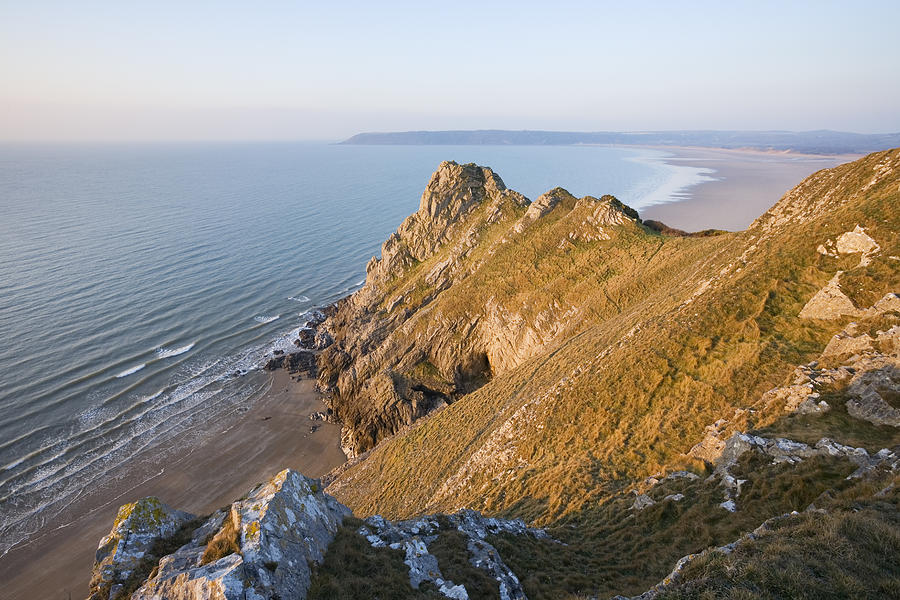 The rocky coastline at Oxwich Bay from Great Tor at sunrise on the Gower peninsula, Swansea. Photograph by James Osmond