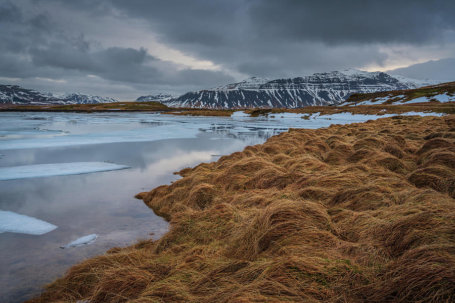 The roughness of Iceland. At the lake of Kirkjufell and looking to the mountains on the other side. Photograph by Anges Van der Logt