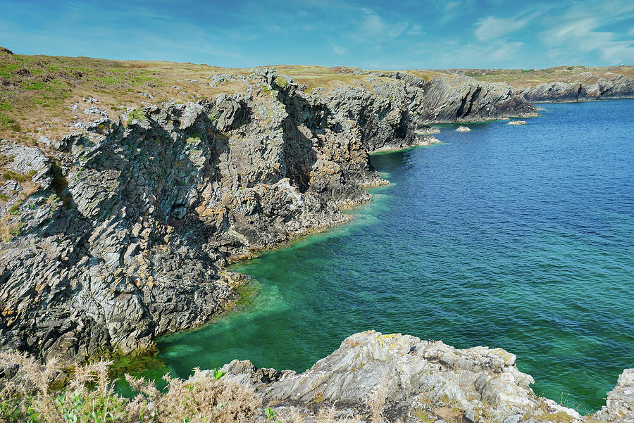 The rugged, rocky coastline of the island of Anglesey in Wales UK ...