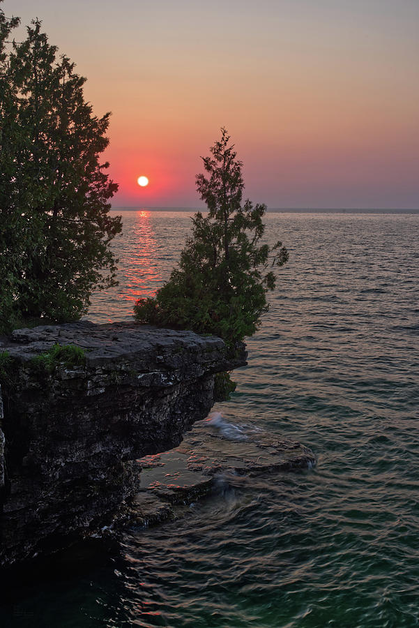 The Sentinel Cedar -  the iconic  cedar watching over Lake Michigan at Cave Point 2 - Door County WI Photograph by Peter Herman