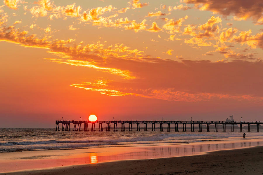 The Setting Sun Balances on Top of the Pier Photograph by Lindsay Thomson