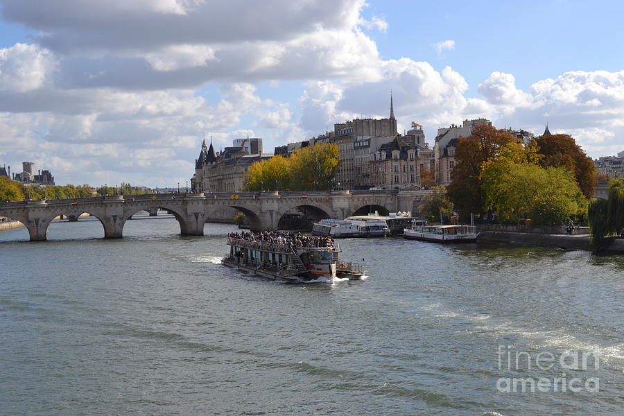 The Siene River in Paris, France with Tourist Boat Photograph by Barbra Telfer