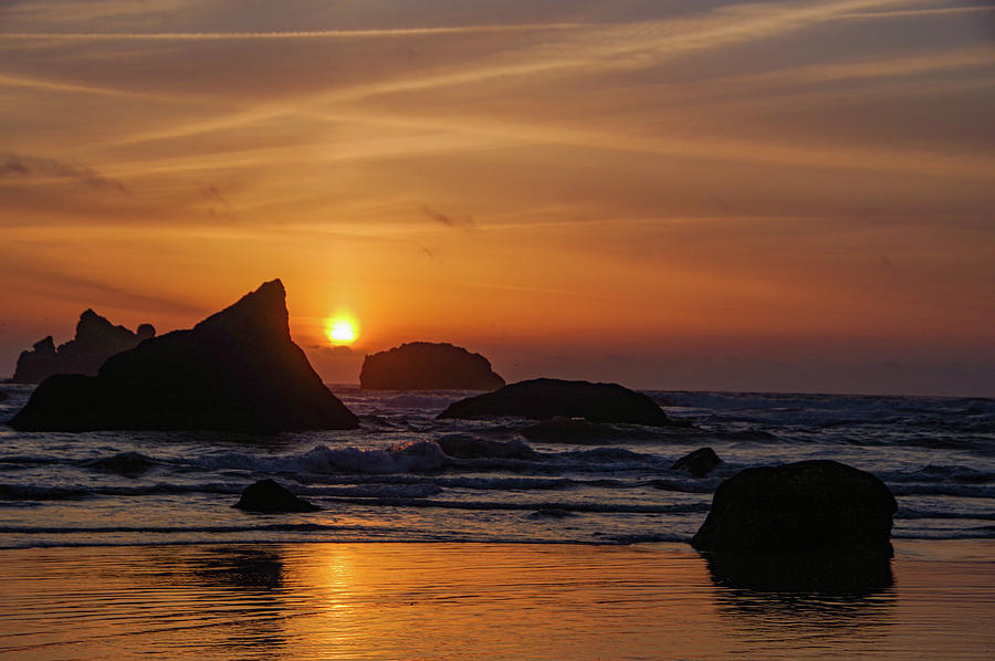 The slow settling of day in Bandon Oregon Photograph by Jeff Swan