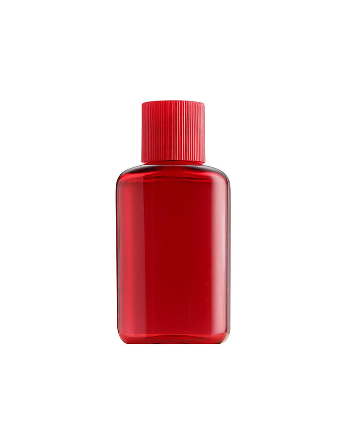 The Small Bottle Red Color Packaging Isolated Photograph by Settaphan