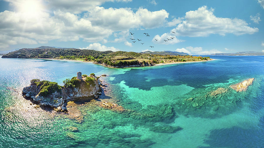 The small island Monastiri at the beach Nisiotissa in Evia islan Photograph by Constantinos Iliopoulos