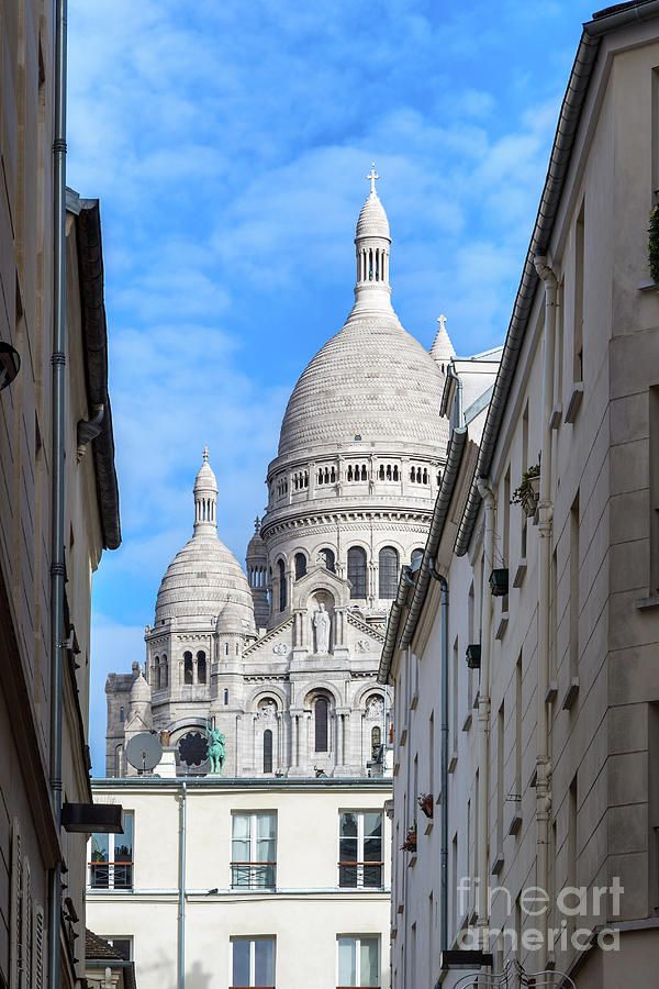 The south facade of the basilica of the Sacre-Coeur, or sacred heart,through the streets of Montmartre, Paris. Photograph by Jane Rix