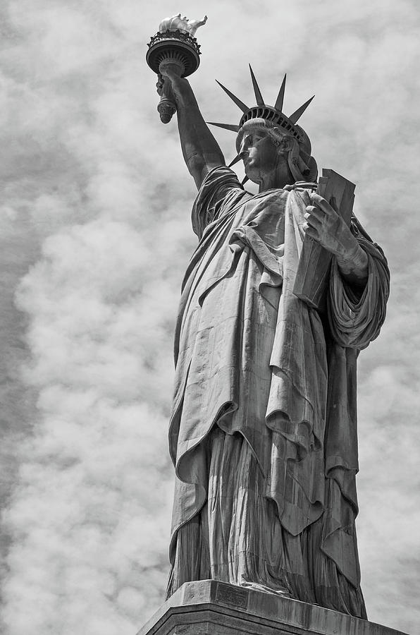 City Photograph - The Statue of Liberty Standing Tall over New York Dramatic Clouds Black and White by Toby McGuire