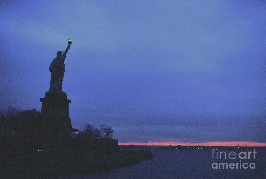 The Statue Of Libertys Torch At Dawn. Photograph by Tom Wurl