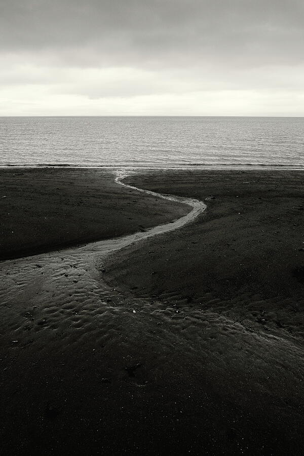 The stream runs to the sea Photograph by Alan Norsworthy