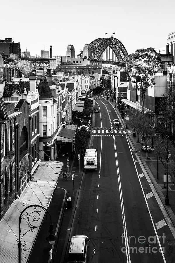 The street of the Rocks area at the foot of the famous Sydney ha Photograph by Didier Marti