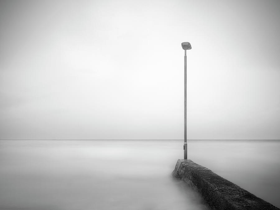 The streetlight lamp and the sea Photograph by Andrea Lorenzetti - Fine ...