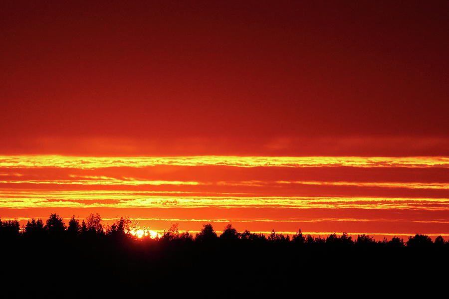 The sun goes down burning hot Photograph by Jouko Lehto