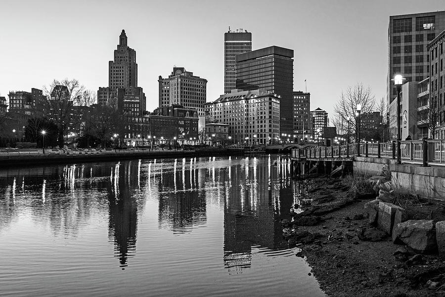 The sun goes down on the Providence Rhode Island RI Skyline and River Calm Reflection BW Photograph by Toby McGuire