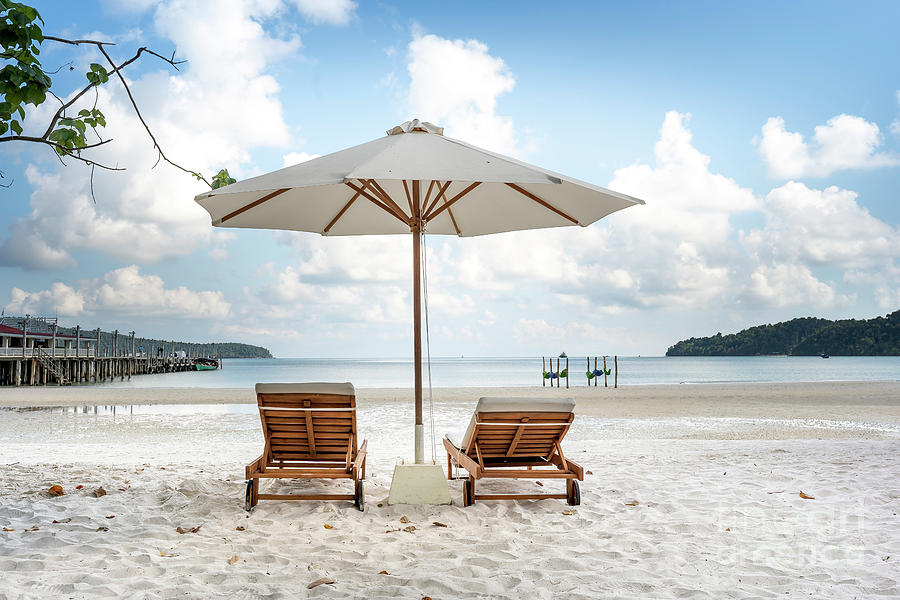 The Sun Loungers Under Umbrellas On The Sandy Beach On Paradise Island Villa Koh Rong Samloem