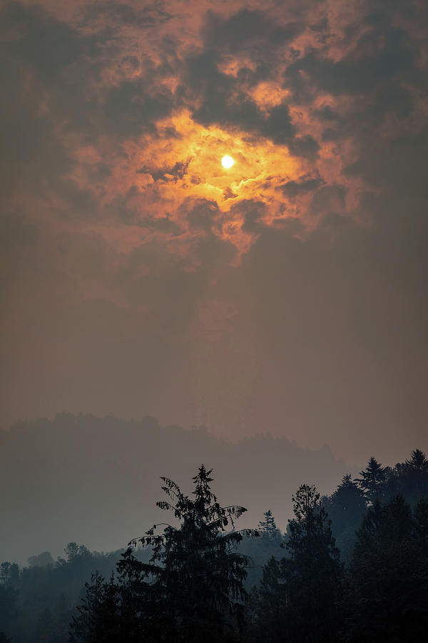 The sun peaking through the smoke Photograph by Pierre Leclerc Photography