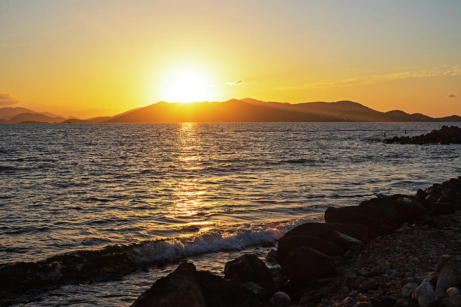 The sun rises over Saint John from Sapphire Beach Saint Thomas Photograph by Toby McGuire