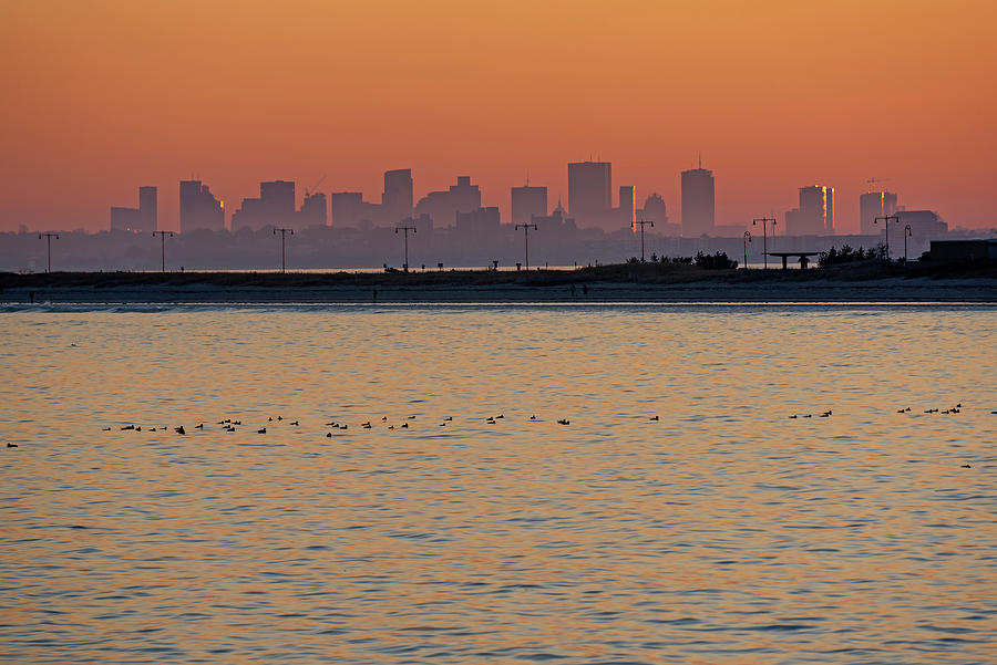 The sun sets on Boston Massachusetts Skyline and Nahant Beach Golden Glow Photograph by Toby McGuire