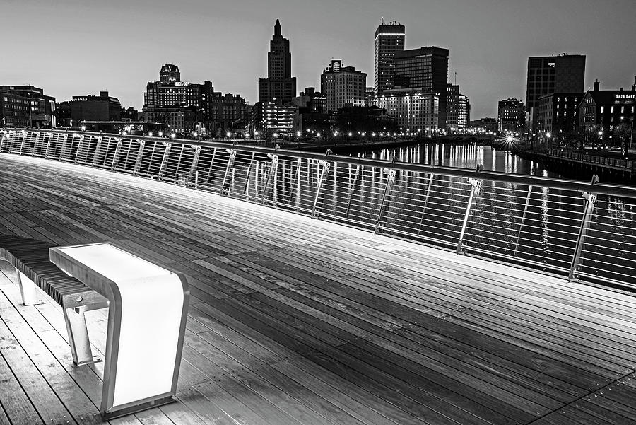 The sun sets on Providence Rhode Island from the PVD Pedestrian Bridge Lighted Bench Black and White Photograph by Toby McGuire