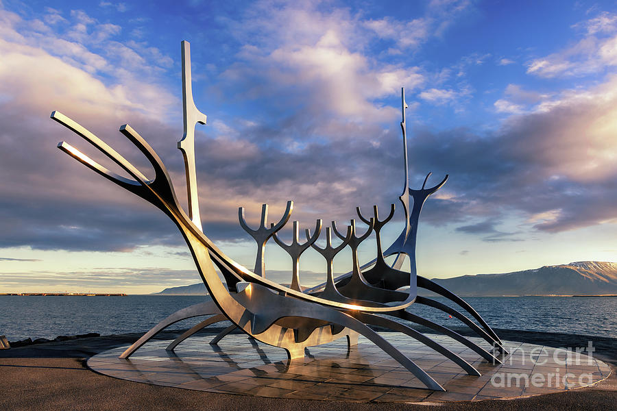 The Sun Voyager, a modern sculpture by Jon Gunnar Arnason, of a viking ship. Sunrise in Reykjavik, Iceland. Photograph by Jane Rix