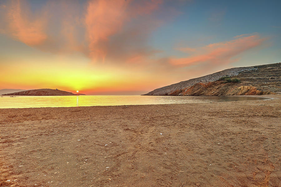 The sunrise behind in Livadi beach of Folegandros island, Greece Photograph by Constantinos Iliopoulos