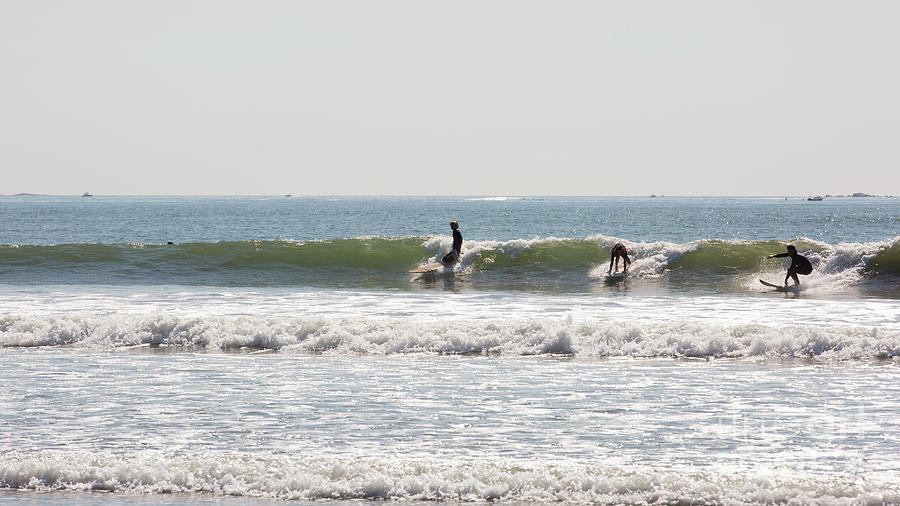 The trio of surfers Photograph by Agnes Caruso