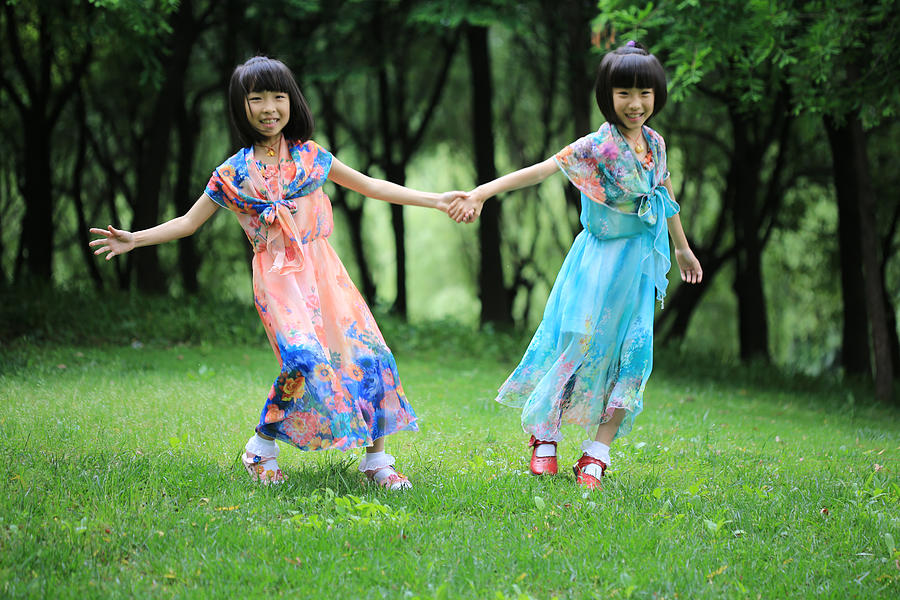 The twin sisters dance in the woods Photograph by Bin Cai