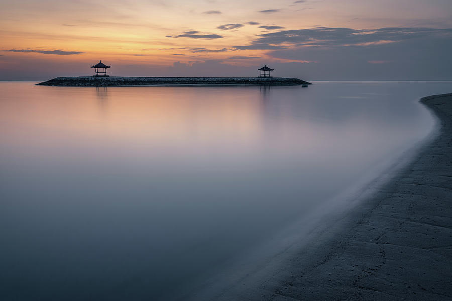 The two gazebos just off the beach in the ocean at Karang beach, seen from the shore Photograph by Anges Van der Logt