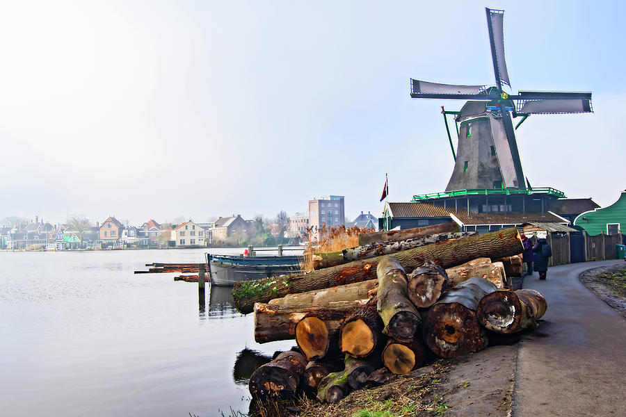 The windmill and the logs Photograph by Pedro Cardona Llambias