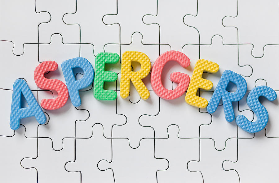 The Word Aspergers Spelled On Blank Puzzle Pieces Photograph by Sdominick
