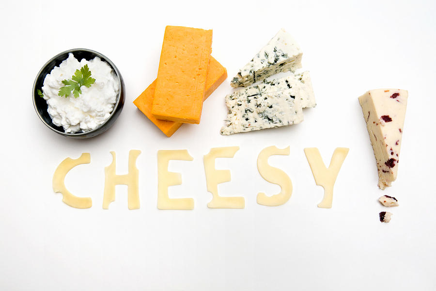 The word cheesy made out of cheese Photograph by Image Source