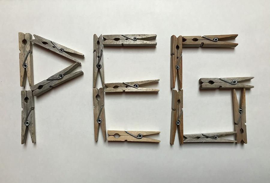 The Word PEG Composed of Wooden Pegs Photograph by Jan Dolezal - Pixels