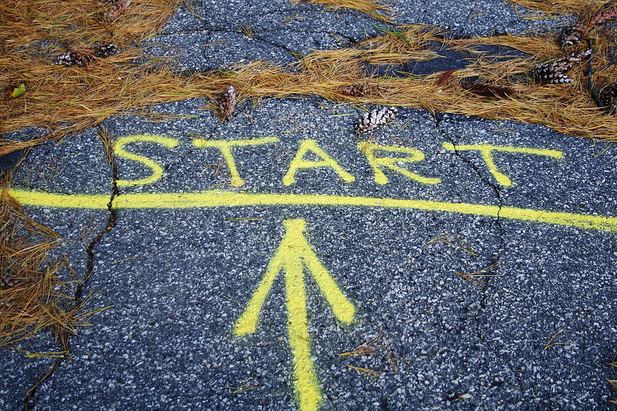 The word start and an arrow painted on sidewalk Photograph by Greg Wehmeyer