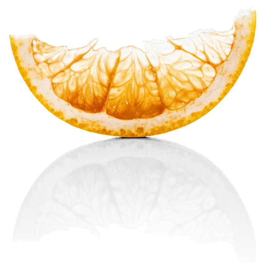 Thin slice of grapefruit Photograph by Creative Crop