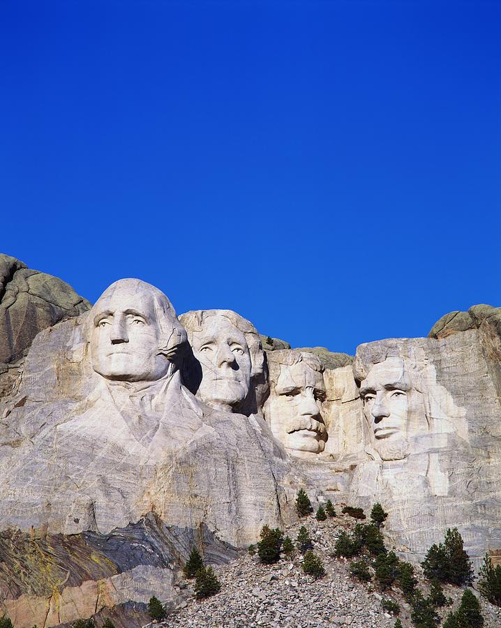 This is a vertical image of Mount Rushmore National Monument showing the four faces of George Washington, Thomas Jefferson, Theodore Roosevelt, and Abraham Lincoln. Photograph by VisionsofAmerica/Joe Sohm