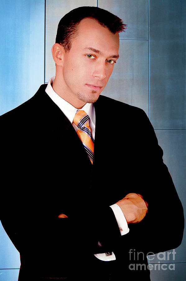 This very sexy and handsome businessman poses for a professional studio portrait. Photograph by Gunther Allen