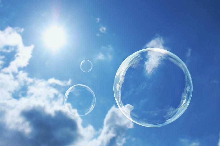 Thought Bubbles Against A Deep Blue Sky Photograph