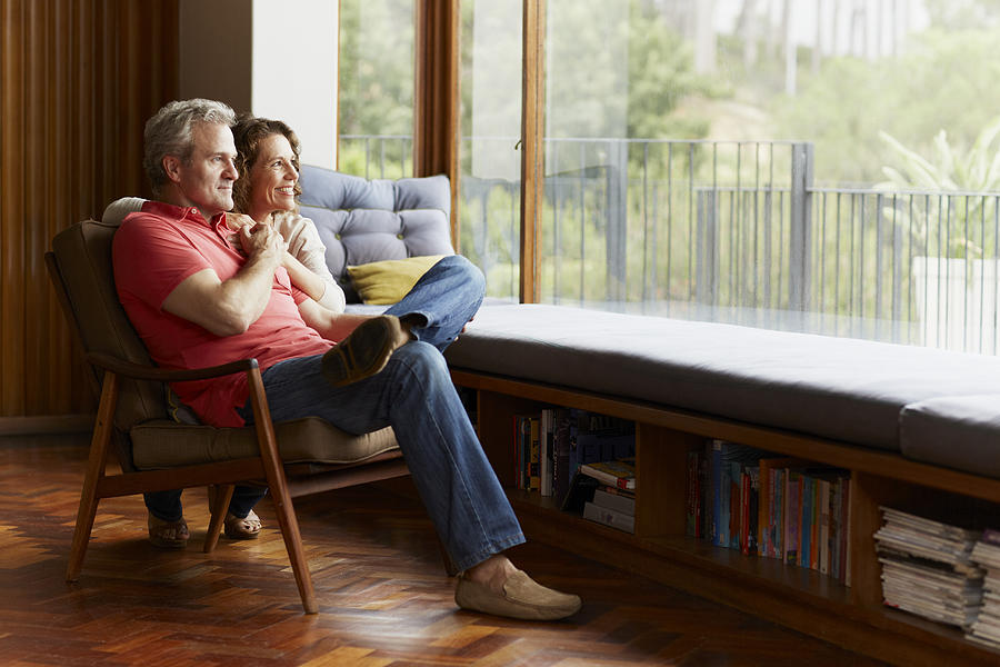 Thoughtful mature couple at home Photograph by Morsa Images