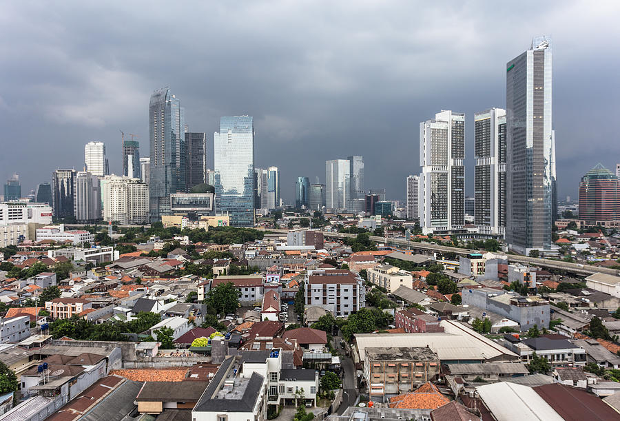 Threatening clouds over Jakarta skyline, Indonesia capital city Photograph by @ Didier Marti