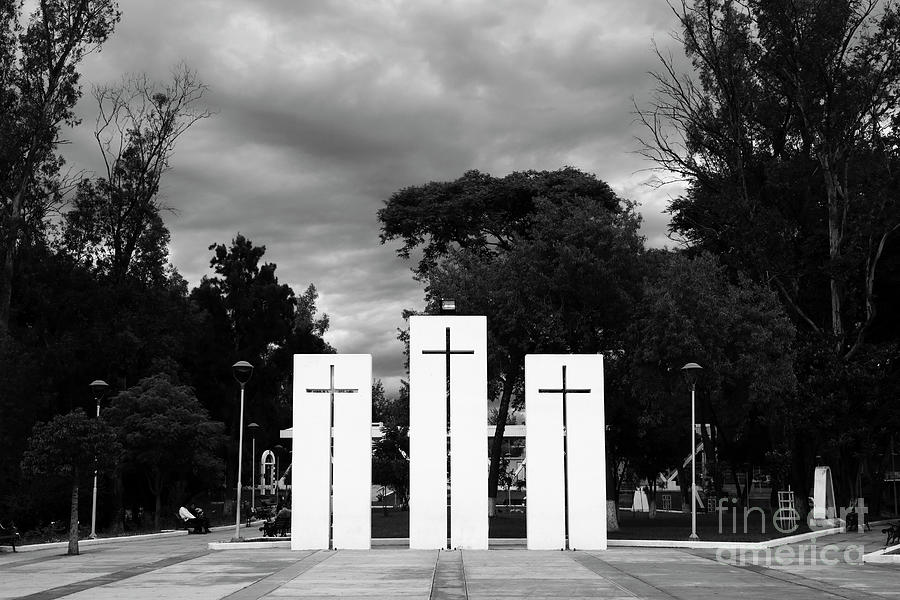 Three crosses and stormy sky in monochrome Photograph by James Brunker