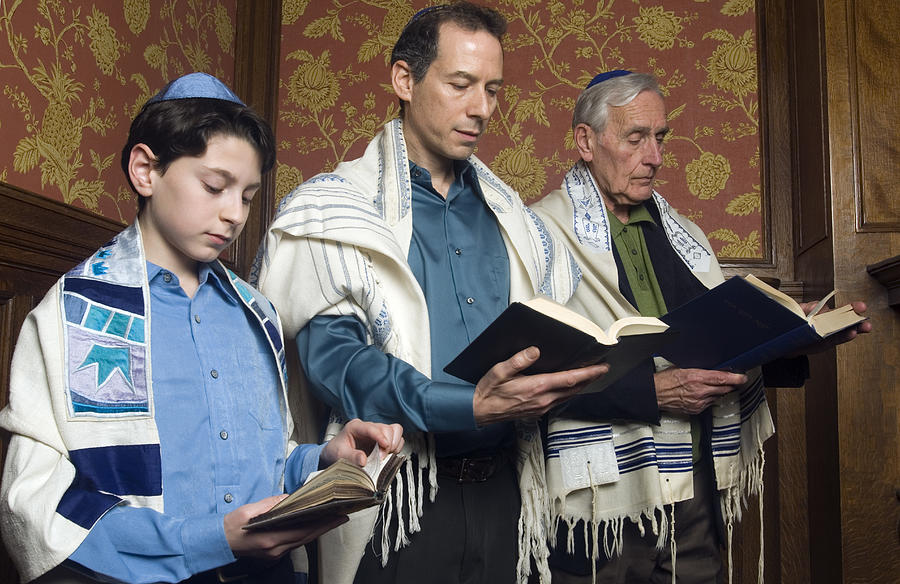 Three Generations Reading from the Torah Photograph by Leland Bobbe