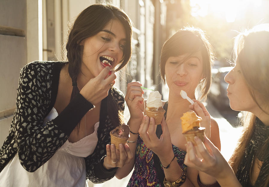 Three Girlfriends Eating Icecream Photograph by Kathrin Ziegler