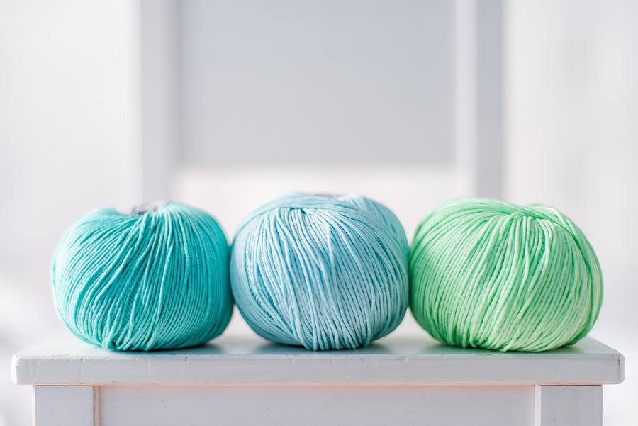 Three green yarn balls Photograph by Click&Boo