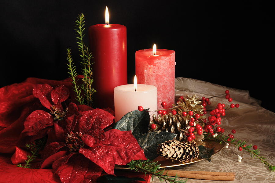 Three grouped Christmas candles standing among garlands Photograph by Pears2295