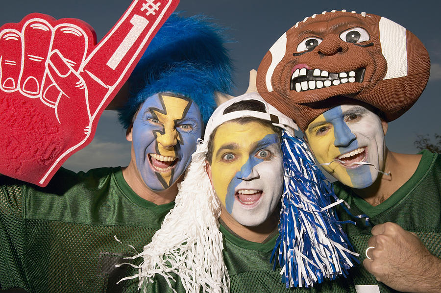 Three male football fans wearing face paint, gesturing Photograph by Glg3