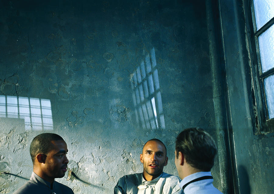 Three men talking Photograph by Frederic Cirou