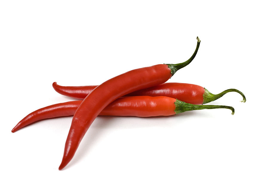 Three red chili peppers on a white background Photograph by Love_life