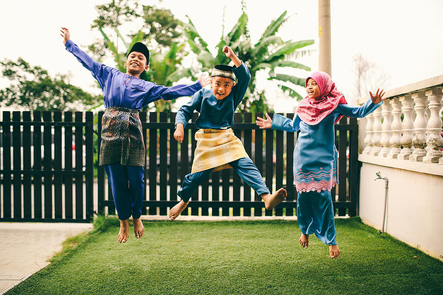 Three sibling playing in front of house Photograph by Ibnjaafar