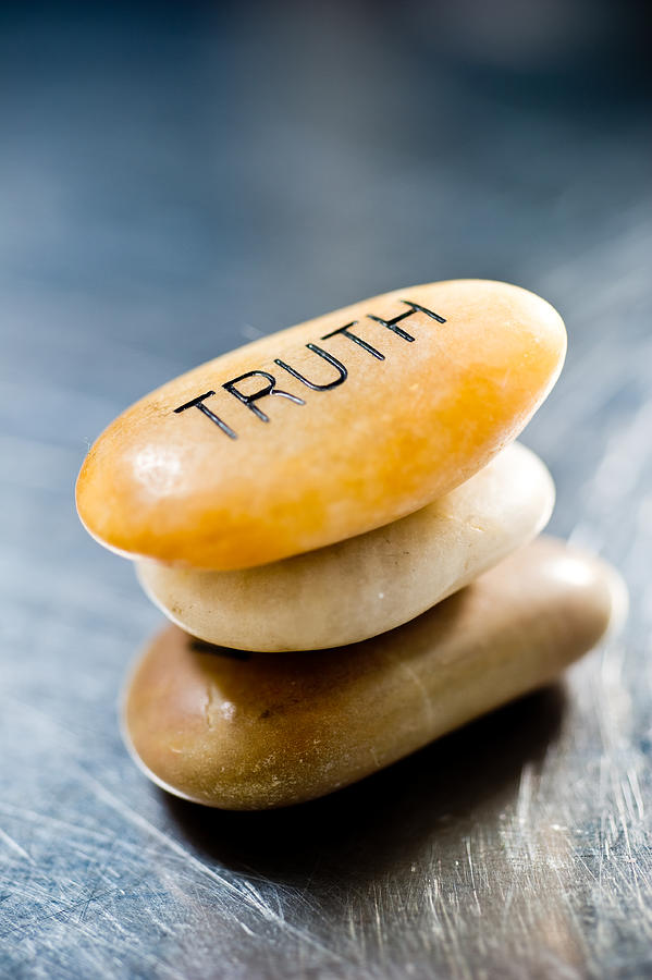 Three smooth, stacked stones with the top one saying truth Photograph by Pflorendo
