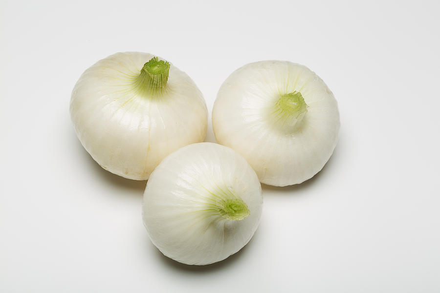 Three spring onion isolated on white background Photograph by Jean-Marc PAYET Three spring onion isolated on white background Photograph by Jean-Marc PAYET