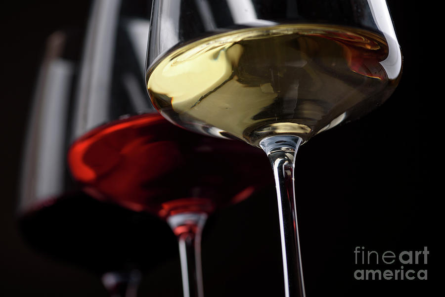 Three Wine Glasses With Red White And Rose Wine On Black Background Photograph